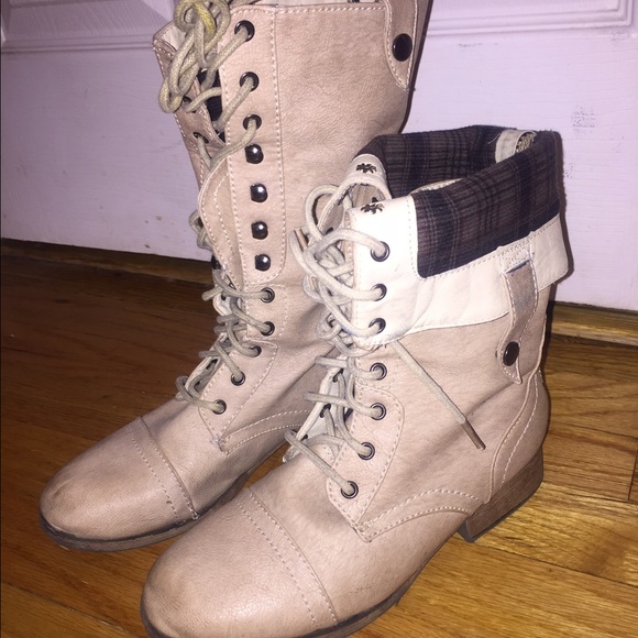 Tan foldover combat boots with plaid inside