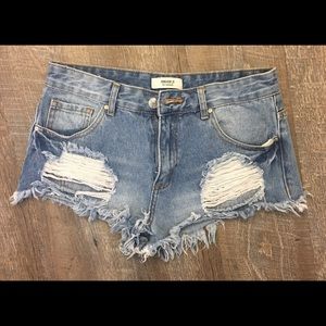 Distressed denim shorts