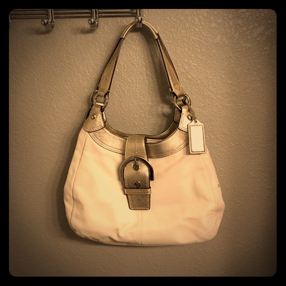 Cream and gold Coach purse