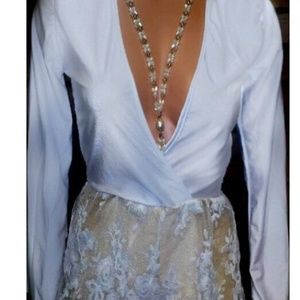 Deep plunge white romper