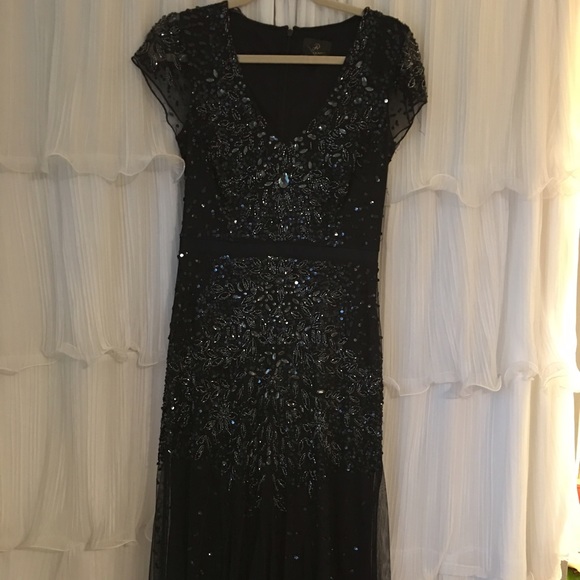 Floor length dark blue beaded evening gown