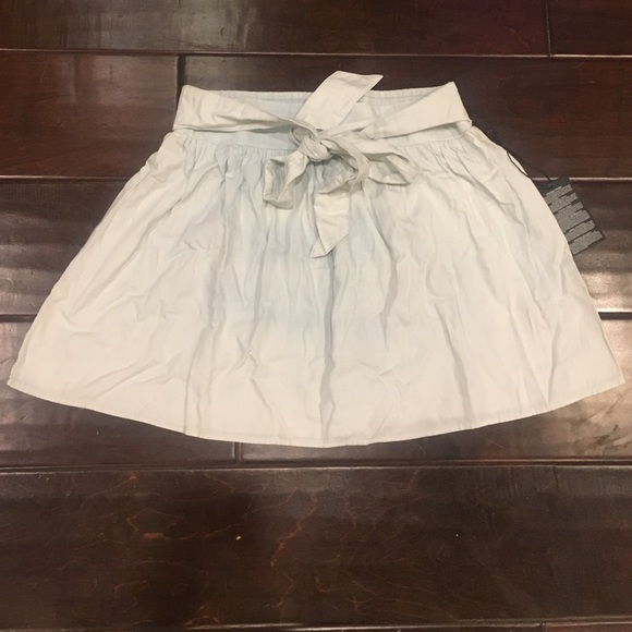 light denim short skirt bow in the front !!