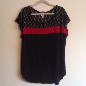 Black and white polka dot shirt with red accent