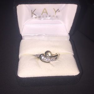 Kay Jewelers heart diamond and gold ring.