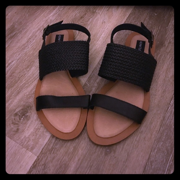 Adam Tucker sandals with black straps.