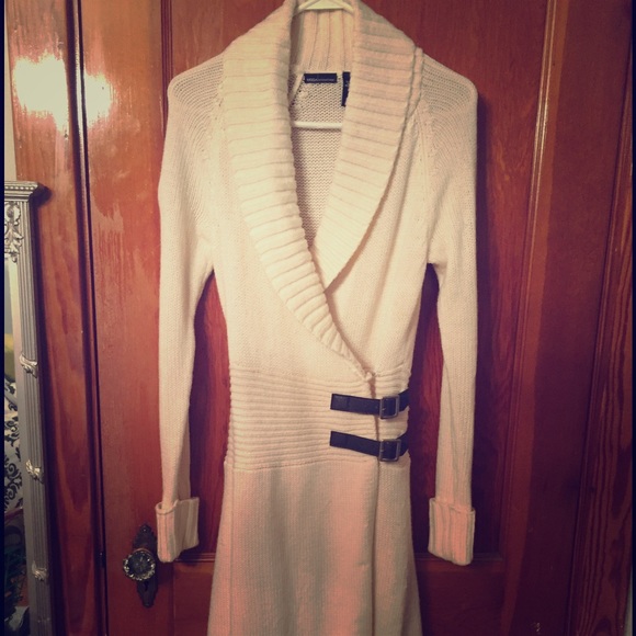 Ivory sweater dress below the knee.