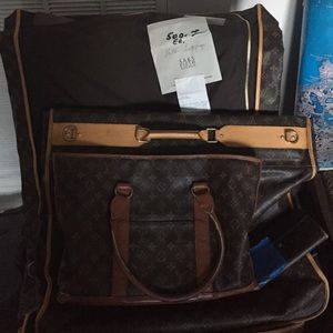 2 Louie Vuitton garment bags 1 tote Saks receipt