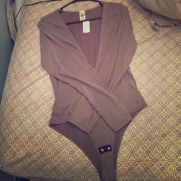 Gray V cut bodysuit.