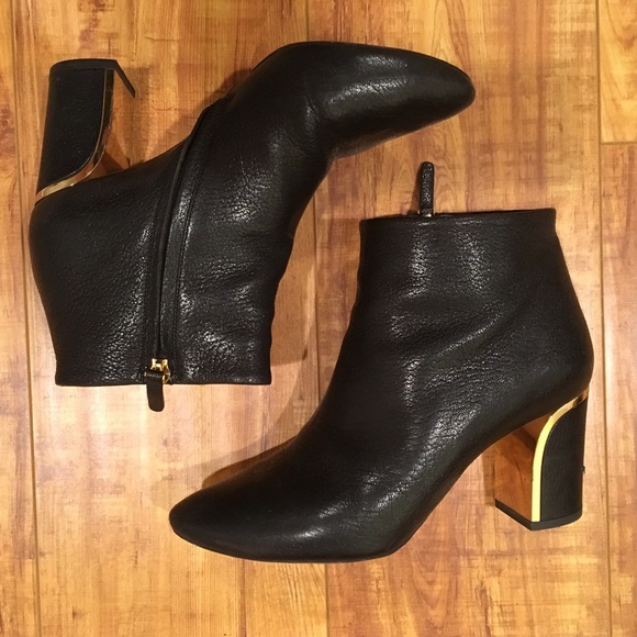 black boots with gold trim