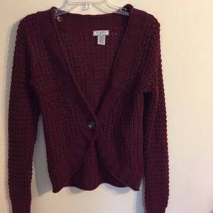 Burgundy cardigan.