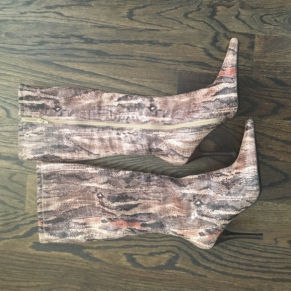 Never worn. Faux skin knee high boots.