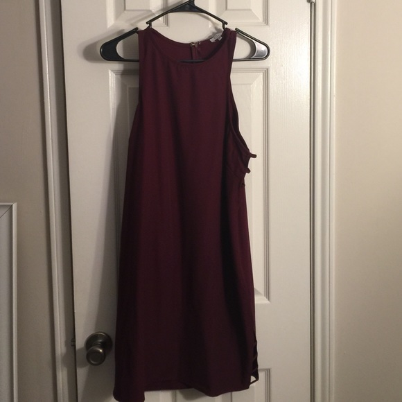 Sleeveless maroon dress with cut outs on side