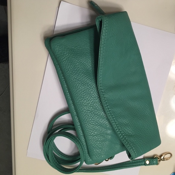 Mint green fold over clutch.