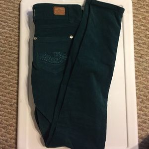 Dark green corduroy pants.
