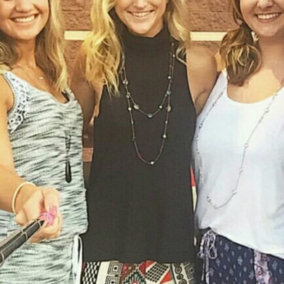 Turtleneck sleeveless black top