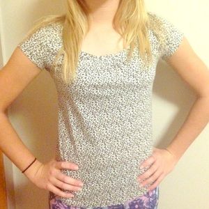 Grey and white floral blouse.