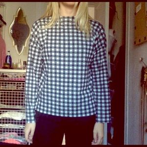 Black & white checkered top with slight mock neck