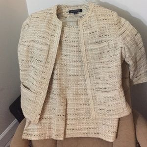 Cream-colored two-piece Anne Klein suit.
