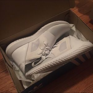 All white ADIDAS tubular defiant