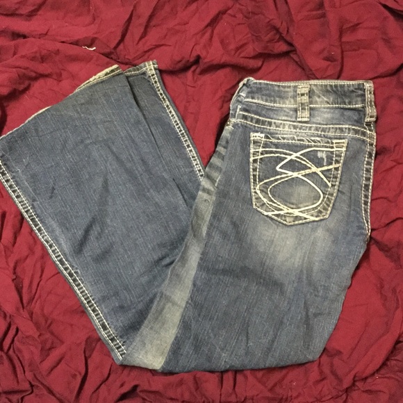 Distressed silver jeans