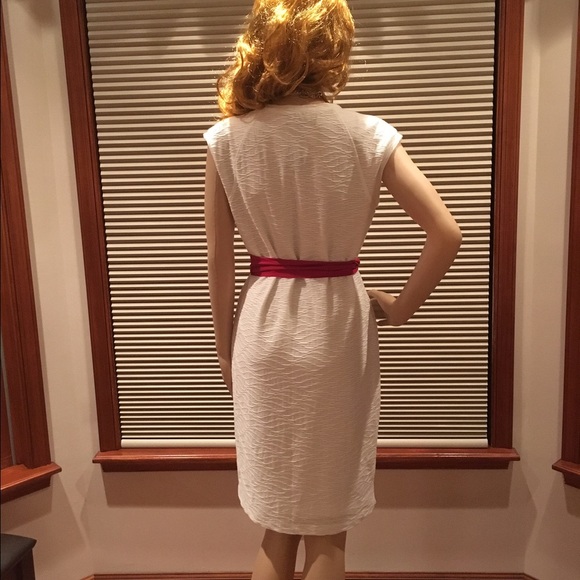 Sleeveless light cream colored contoured dress