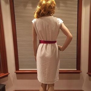 Sleeveless light cream colored contoured dress