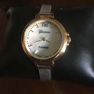 NIB Geneva platinum watch with motherpearl face.