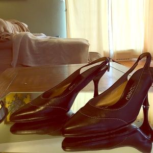 Ferragamo black leather slingbacks.
