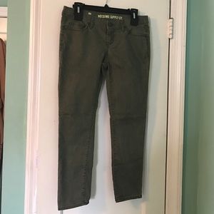 Army green cropped skinny jeans