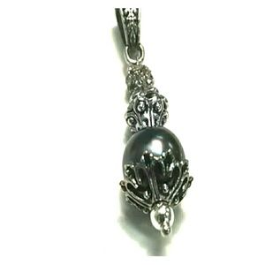Black pearl pendant with silver accents