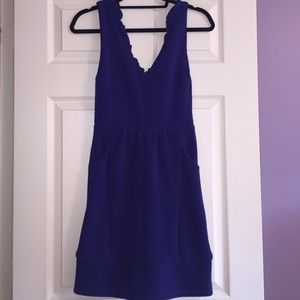 Purple mini dress with pockets and ruffles. NWT