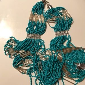 Long teal, silver, and clear beaded necklace