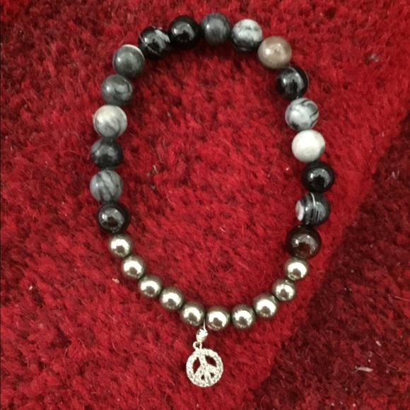 Beaded Bracelet with real stones and a Peace Charm
