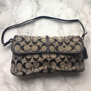 Black and grey/silver Coach mini hand bag.