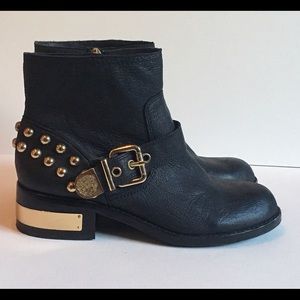 Black leather and gold accented booties