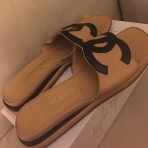 Camel and black Chanel slides