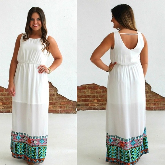 Brand new White maxi dress with bottom accents.