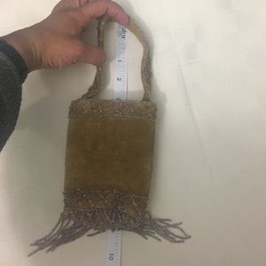 Cylinder shaped suede bag with bead detail
