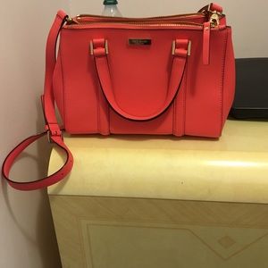 Watermelon color Kate Spade tote and cross body