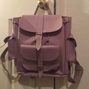 A dark lavender leather Grafea backpack.