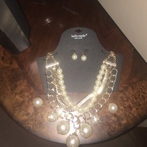 gold and pearl necklace and earrings