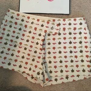 J Crew turtle print shorts on cream background