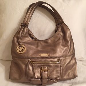 Michael Kors - Gold tone bag.