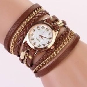 Gold and brown leather banded watch