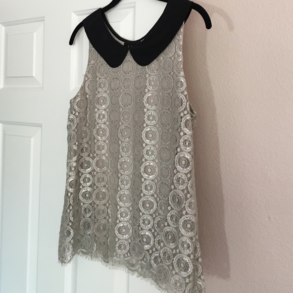 Cream and silver sleeveless blouse