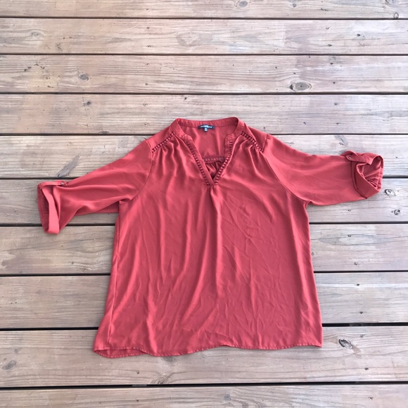 Women's burnt orange colored blouse