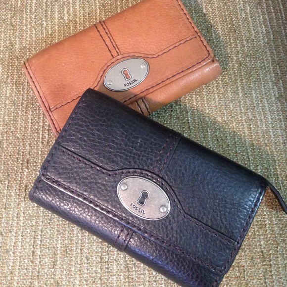 Two Tan and Black Fossil Wallets