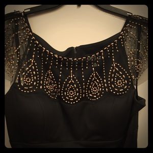 Black cocktail dress. Antique gold beading.