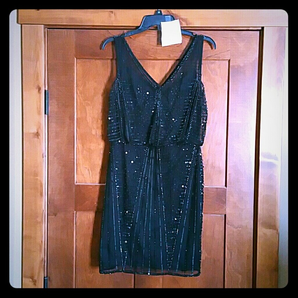Size 8/10 short black,hand beaded cocktail dress.