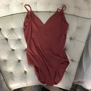 Ribbed rust color body suit